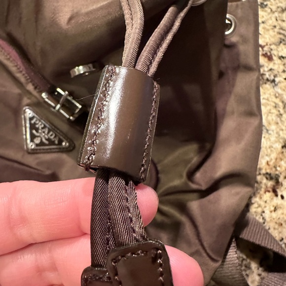 Prada backpack. Pre loved. Brown in color. Pockets inside and outside. - Picture 10 of 12